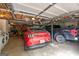 Attached garage with a red Mustang, a dark truck, and washer/dryer at 614 Highway 85 Conn, Brooks, GA 30205