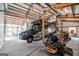 Large garage featuring a modern RV, ample workspace, and storage, perfect for hobbyists and vehicle enthusiasts at 614 Highway 85 Conn, Brooks, GA 30205