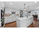 Beautiful kitchen with white cabinets, stainless steel appliances, and a large center island at 614 Highway 85 Conn, Brooks, GA 30205