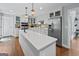 Modern kitchen featuring a large island, stainless steel appliances, and custom cabinetry at 614 Highway 85 Conn, Brooks, GA 30205