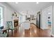 Bright and airy kitchen with white cabinetry, stainless steel appliances, and a cozy fireplace at 614 Highway 85 Conn, Brooks, GA 30205