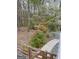 Backyard with beautiful landscaping, mature trees, and flowering shrubs at 614 Highway 85 Conn, Brooks, GA 30205