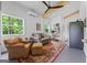 Cozy living room featuring a comfortable seating area, wooden ceiling beams, and ample natural light at 614 Highway 85 Conn, Brooks, GA 30205