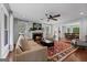 Spacious living room with fireplace and seamless flow to dining area at 614 Highway 85 Conn, Brooks, GA 30205