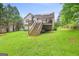 Backyard features a spacious deck accessible by stairs, offering great outdoor enjoyment at 103 Manx Dr, Grantville, GA 30220