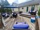 Spacious backyard deck area ideal for entertaining, complete with cozy seating arrangements at 103 Manx Dr, Grantville, GA 30220