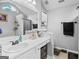 Bright bathroom features a large vanity, ample lighting, and a clean, modern design for a refreshing experience at 103 Manx Dr, Grantville, GA 30220