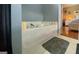 Relaxing bathroom featuring a large soaking tub, perfect for unwinding after a long day at 103 Manx Dr, Grantville, GA 30220