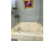 Elegant bathroom with a spacious soaking tub for a luxurious bathing experience at 103 Manx Dr, Grantville, GA 30220