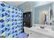 Charming bathroom with blue accents, vanity, and thoughtful storage for a cozy and functional space at 103 Manx Dr, Grantville, GA 30220