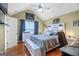 Cozy bedroom with vaulted ceilings, hardwood floors, and natural light creates a serene retreat at 103 Manx Dr, Grantville, GA 30220