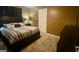 Relaxing bedroom featuring a king-sized bed, dresser, and a serene atmosphere at 103 Manx Dr, Grantville, GA 30220