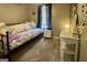 Charming bedroom with daybed, nightstand, and makeup table illuminated by a mushroom lamp at 103 Manx Dr, Grantville, GA 30220
