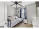 Bedroom with window and ceiling fan features a comfortable bed and lots of light at 103 Manx Dr, Grantville, GA 30220