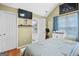 Comfortable bedroom with connected bathroom, hardwood floors, and ample storage for a relaxing, private sanctuary at 103 Manx Dr, Grantville, GA 30220