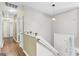 Bright hallway features wood floors, white trim, and a welcoming entryway, perfect for a stylish home at 103 Manx Dr, Grantville, GA 30220