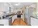 Modern kitchen features stainless appliances, granite counters, ample cabinet space, and a functional layout for everyday convenience at 103 Manx Dr, Grantville, GA 30220