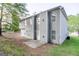 Backyard view of the home's gray siding and windows surrounded by green lawn at 3313 Bethesda Ter, Acworth, GA 30101