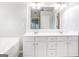 Bathroom featuring a double sink vanity with white cabinets and a large mirror at 3313 Bethesda Ter, Acworth, GA 30101