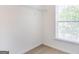 A bedroom closet featuring a metal shelf and a window for natural light at 3313 Bethesda Ter, Acworth, GA 30101