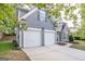 A two-story home featuring a two car garage, a stone facade, gray siding, and a well-manicured lawn at 3313 Bethesda Ter, Acworth, GA 30101