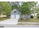 Charming two-story home featuring a stone facade, gray siding, well-maintained lawn, and a two car garage at 3313 Bethesda Ter, Acworth, GA 30101