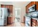 Well-equipped kitchen with stainless steel appliances, dark wooden cabinets, hardwood floors, and lots of storage at 3313 Bethesda Ter, Acworth, GA 30101