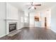Open-concept living room with a fireplace, wood floors, and view to kitchen at 3313 Bethesda Ter, Acworth, GA 30101