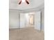 A view of the main bedroom showcasing the tray ceiling and a doorway leading to the bathroom at 3313 Bethesda Ter, Acworth, GA 30101