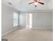 Spacious main bedroom with neutral carpet, ceiling fan, and walk-in closet at 3313 Bethesda Ter, Acworth, GA 30101