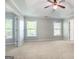 Spacious main bedroom featuring a ceiling fan, a tray ceiling and ample natural light from the windows at 3313 Bethesda Ter, Acworth, GA 30101