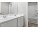 Bathroom featuring a double sink vanity, and a separate shower and tub at 8069 Louis Dr, Locust Grove, GA 30248