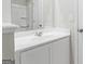 Bathroom features white cabinets, granite counters, sink, shower and tile flooring at 8069 Louis Dr, Locust Grove, GA 30248