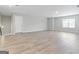 Bonus room featuring wood-look flooring, a large window, and neutral-toned walls at 8069 Louis Dr, Locust Grove, GA 30248