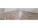 Wood-look flooring creates a seamless and stylish design throughout the living spaces and adjoining rooms at 8069 Louis Dr, Locust Grove, GA 30248