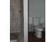 Bathroom features a tiled shower and a commode at 1023 Falling Water Se Dr, Smyrna, GA 30080
