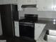 The kitchen features stainless steel appliances and updated granite countertops at 1023 Falling Water Se Dr, Smyrna, GA 30080