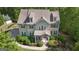 A beautiful home with lush landscaping, mature trees, and a welcoming front porch at 335 Discovery Lake Dr, Fayetteville, GA 30215