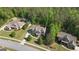 Aerial view of home in a wooded community, showcasing the well-maintained lawns and landscaped yards at 335 Discovery Lake Dr, Fayetteville, GA 30215