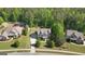 Residential aerial view of home in a beautiful, wooded community with well-manicured lawns at 335 Discovery Lake Dr, Fayetteville, GA 30215
