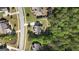A bird's eye view of a well-maintained home and neighborhood, surrounded by mature trees at 335 Discovery Lake Dr, Fayetteville, GA 30215
