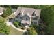 A well-maintained home with a lovely front yard, surrounded by mature trees and landscaping at 335 Discovery Lake Dr, Fayetteville, GA 30215
