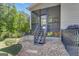 Cozy screened-in back porch with stairs leading to a beautiful landscaped backyard at 335 Discovery Lake Dr, Fayetteville, GA 30215