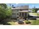 Expansive backyard with screened porch, trampoline and lush lawn, perfect for entertaining and play at 335 Discovery Lake Dr, Fayetteville, GA 30215