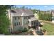 A spacious backyard featuring a screened porch and a trampoline, surrounded by mature trees at 335 Discovery Lake Dr, Fayetteville, GA 30215