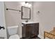 A compact bathroom features a dark vanity, a toilet and dark fixtures at 335 Discovery Lake Dr, Fayetteville, GA 30215