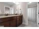 Bathroom featuring double vanity, granite countertop and tile floors adjacent to tub shower combination at 335 Discovery Lake Dr, Fayetteville, GA 30215