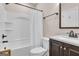Bright bathroom features tub with shower, vanity with countertop, and neutral wall color at 335 Discovery Lake Dr, Fayetteville, GA 30215