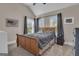 Spacious carpeted bedroom featuring vaulted ceiling, dark curtains and lots of natural light at 335 Discovery Lake Dr, Fayetteville, GA 30215