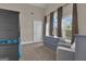 Bedroom with large windows, dresser, accent chair and carpet floors with lots of natural light at 335 Discovery Lake Dr, Fayetteville, GA 30215